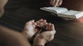 An Asian man is reading the scripture or holy bible. God's teachings according to belief and faith in God. Royalty Free Stock Photo