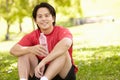 Asian man resting after exercise Royalty Free Stock Photo