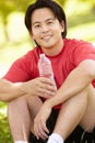 Asian man resting after exercise Royalty Free Stock Photo