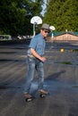 An Asian man riding a freeline drift skate. Royalty Free Stock Photo