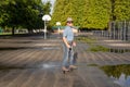 An Asian man riding a freeline drift skate. Royalty Free Stock Photo