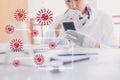 Asian man scientist Chemical research working in lab inject red liquids hold tablet with covid 19 ai for stop covid 19 virus covid
