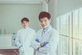 Asian man scientist posing with arms crossed working in hospital,Professional medical teamwork