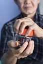 Asian man screwing the cap of glass bottle. Concept of hand muscle strength and power Royalty Free Stock Photo