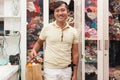 Asian man shopping bag in tailor fashion shop with