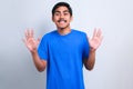 Asian man showing and pointing up with fingers various number Royalty Free Stock Photo