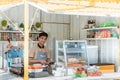 Asian man small business owner at his shop made of truck container Royalty Free Stock Photo