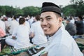 Asian man smile happily at Eid al-Fitr prayers Royalty Free Stock Photo