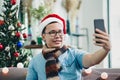 Asian man smile and take selfie photo with mobile phone with bl Royalty Free Stock Photo