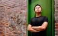 Asian man stand against a old door and lonely Royalty Free Stock Photo