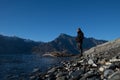 Asian man stand at the front of beautiful view close to the lake with sunrise in New Zealand Royalty Free Stock Photo