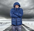 Asian man stand on snow road in winter