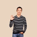 Asian Man In Striped Pullover Royalty Free Stock Photo