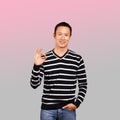 Asian Man In Striped Pullover Royalty Free Stock Photo