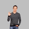 Asian Man In Striped Pullover Royalty Free Stock Photo