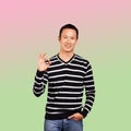 Asian Man In Striped Pullover Royalty Free Stock Photo