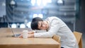 Asian man student taking a nap in college library Royalty Free Stock Photo