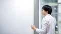 Asian man teacher writing on blank whiteboard Royalty Free Stock Photo