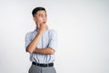 asian man thinking something and looking to the side Royalty Free Stock Photo