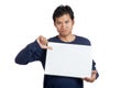 Asian man thumbs down with a blank sign Royalty Free Stock Photo