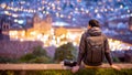 Asian man traveler looking at Cusco city at night