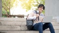 Asian man university student sitting on stair Royalty Free Stock Photo