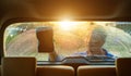 Asian man using blue sponge with soap to washing the car at outdoor in sunset time Royalty Free Stock Photo