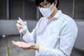 Asian man using hand sanitizer gel washing hand