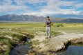 Asian man visiting and taking photo of the nice landscape