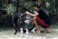 Asian man are washing road bicycle near by home