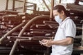 Asian man wear face mask medical protection in wood factory Royalty Free Stock Photo