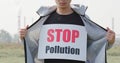Man wear stop pollution sign