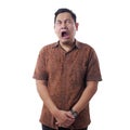 Asian Man Wearing Batik Shirt Crying Hard Royalty Free Stock Photo