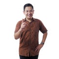 Asian Man Wearing Batik Shirt Raising Pointing Finger, Number One Royalty Free Stock Photo