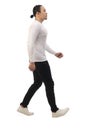 Asian man wearing casual shirt black denim and white shoes, walking forward, side view, happy confidence expression. Full body Royalty Free Stock Photo