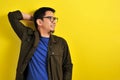 Asian man wearing glasses smiling look at copy Royalty Free Stock Photo