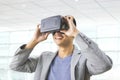 asian man wearing virtual reality goggle