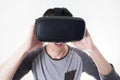 Asian man wearing VR goggle and immersing himself in VR multimedia Royalty Free Stock Photo