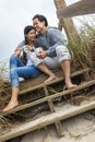 Asian Man Woman Couple Drinking Coffee on Beach Steps Royalty Free Stock Photo