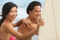 Asian Man Woman Couple Surfboards Surfing on Beach Royalty Free Stock Photo