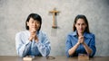 Asian man and woman are going to pray for the Lord`s blessings at the Minster of Christianity. It is the routine of people who Royalty Free Stock Photo