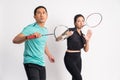 asian man and woman holding racket in ready for shuttle Royalty Free Stock Photo