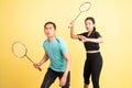 asian man and woman holding racket in ready for shuttle Royalty Free Stock Photo