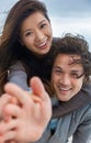 Asian Man Woman Romantic Happy Couple Piggy Back on Beach Royalty Free Stock Photo