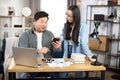 Asian man and woman using smartphone at office Royalty Free Stock Photo