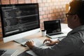 Asian man working code program developer computer web development working design software on desk in office Royalty Free Stock Photo