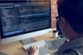 Asian man working code program developer computer web development working design software on desk in office Royalty Free Stock Photo