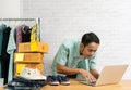 Asian man working laptop computer selling online Royalty Free Stock Photo