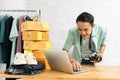 Asian man working laptop computer selling online Royalty Free Stock Photo