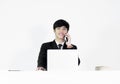 Asian manager businessman sitting at desk and working, isolated Royalty Free Stock Photo